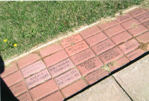 Engraved bricks walkway with personalized messages and names.